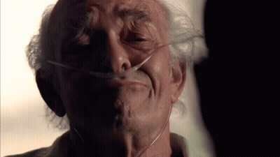 An Elderly Man With An Oxygen Mask On His Face GIF