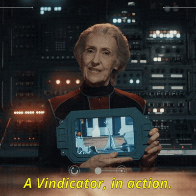 An Elderly Woman Holding A Device That Says Aviminator In Action GIF