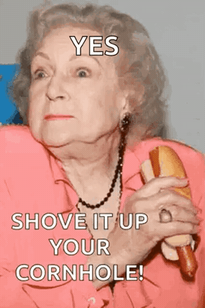 An Elderly Woman Holding A Hot Dog With A Caption That Says Yes Shove It Up Your Cornhole GIF