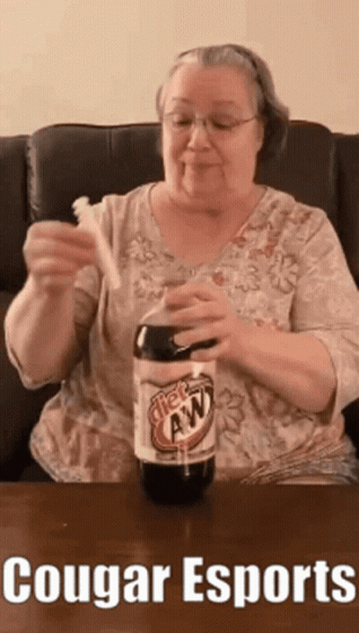 An Elderly Woman Is Holding A Toothbrush And A Bottle Of Root Beer .. GIF