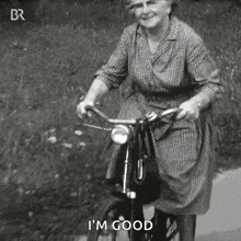 An Elderly Woman Is Riding A Bicycle And Says I 'M Good GIF