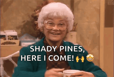 An Elderly Woman Is Sitting At A Table With A Cup Of Coffee And Says Shady Pines Here I Come .. GIF
