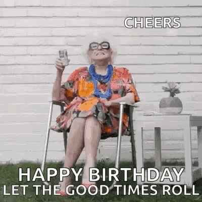 An Elderly Woman Is Sitting In A Chair Holding A Glass Of Wine And A Bottle Of Beer . GIF