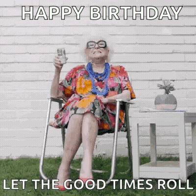 An Elderly Woman Is Sitting In A Chair Holding A Glass Of Wine And A Stack Of Money . GIF