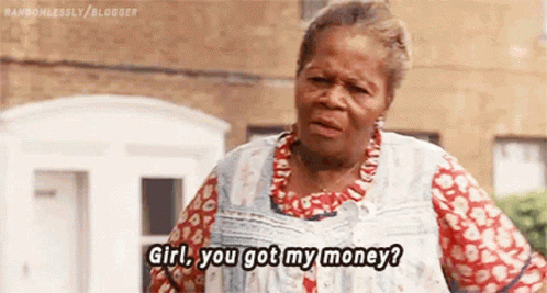 An Elderly Woman Is Standing In Front Of A Building And Talking To Someone . GIF