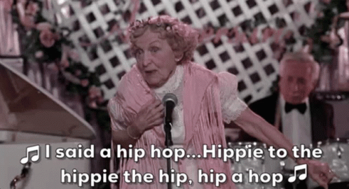An Elderly Woman Singing Into A Microphone With The Words I Said A Hip Hop Hippie To The Hippie GIF