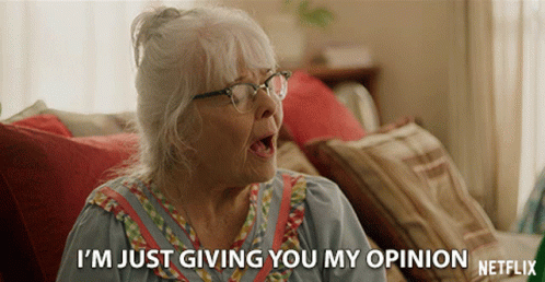 An Elderly Woman Sitting On A Couch Says I 'M Just Giving You My Opinion Netflix GIF
