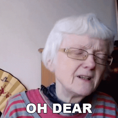 An Elderly Woman Wearing Glasses And A Red And Blue Striped Shirt Says Oh Dear GIF