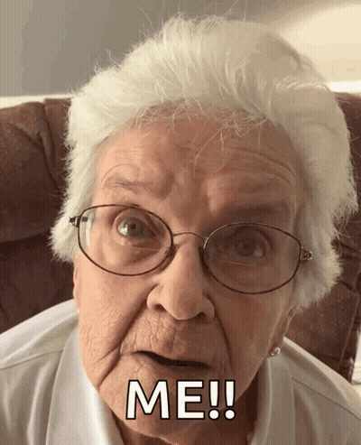 An Elderly Woman Wearing Glasses Says Me ! GIF