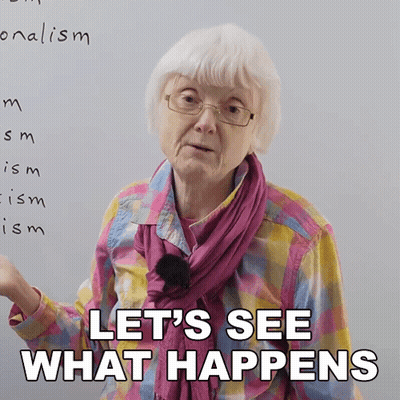 An Elderly Woman With Glasses And A Scarf Says Let 'S See What Happens GIF