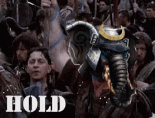An Elephant With A Samurai Helmet Is In A Crowd Of People And The Word Hold Is On The Bottom Right GIF