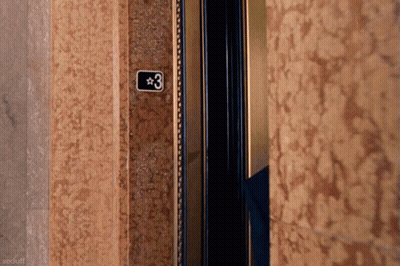 An Elevator With The Number 3 On The Wall GIF