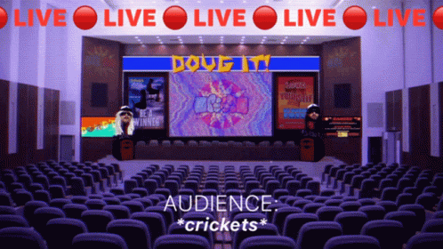 An Empty Auditorium With A Sign That Says Live Live Live GIF