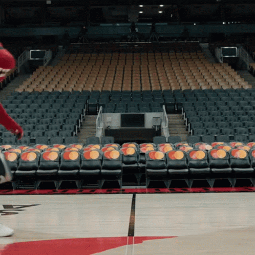 An Empty Basketball Stadium With Rows Of Seats That Say Mastercard On Them GIF
