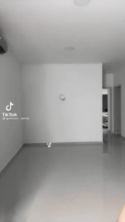 An Empty Room With A Clock On The Wall And A Tiktok Video GIF