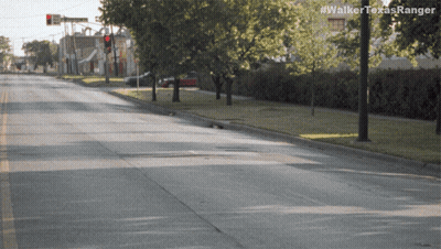 An Empty Street With The Hashtag #Walkertexasranger On The Bottom GIF