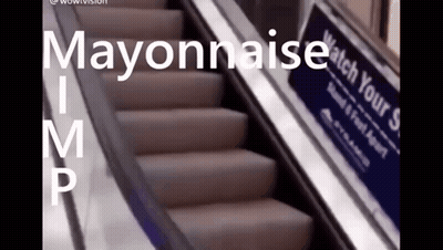 An Escalator With A Sign That Says Mayonnaise GIF