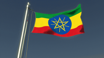 An Ethiopian Flag Flies In The Wind Against A Blue Sky GIF