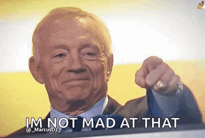 An Older Man In A Suit And Tie Is Pointing At The Camera And Says I 'M Not Mad At That . GIF
