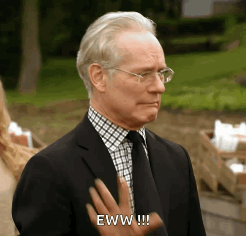 An Older Man In A Suit And Tie Says Eww GIF