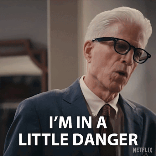 An Older Man In A Suit And Tie Says I 'M In A Little Danger GIF