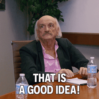 An Older Man Sits At A Table With Bottles Of Water And The Words That Is A Good Idea GIF