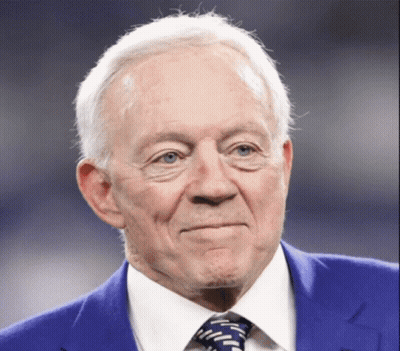 An Older Man Wearing A Blue Suit And Tie GIF