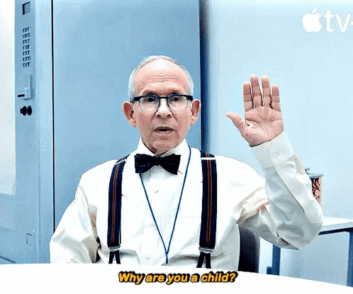 An Older Man Wearing Suspenders And A Bow Tie Is Asking Why Are You A Child GIF