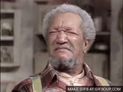 An Older Man With Gray Hair And A Beard Is Making A Face . GIF