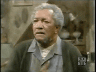 An Older Man With Gray Hair And A Beard Is Making A Funny Face In A Room . GIF