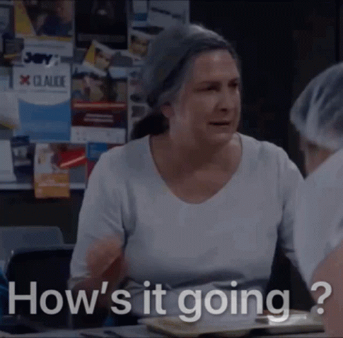 An Older Woman Is Sitting At A Table And Asking How 'S It Going GIF