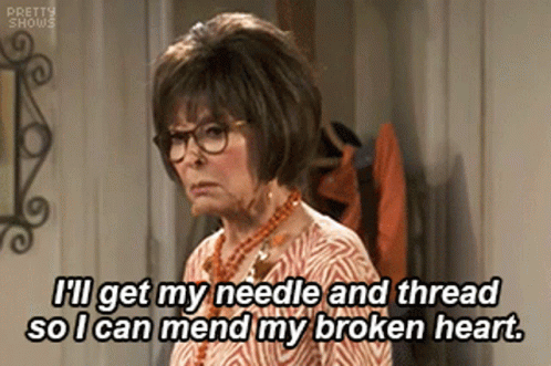 An Older Woman Wearing Glasses And A Necklace Is Saying I 'Ll Get My Needle And Thread GIF