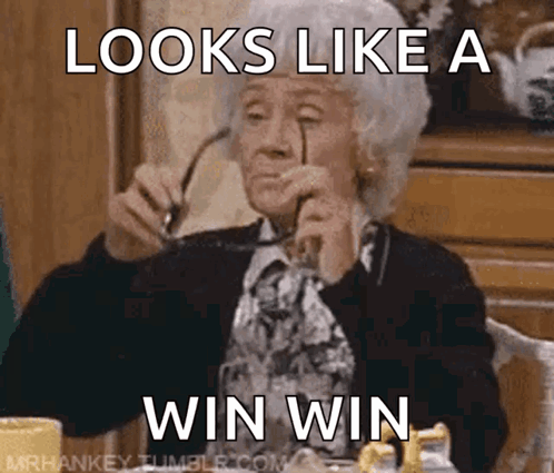 An Older Woman Wearing Glasses Is Sitting At A Table With A Caption That Says " Looks Like A Win Win " GIF