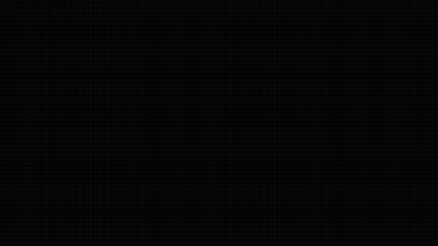 An Orange Car Is Driving Down A Street In A Blurry Photo GIF
