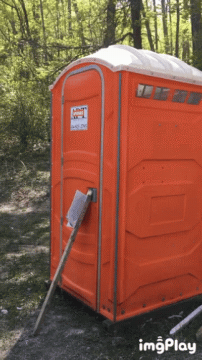 An Orange Portable Toilet With A Sticker On It That Says Imgplay GIF