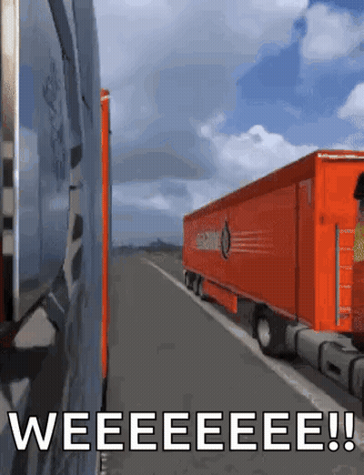 An Orange Semi Truck Is Driving Down A Highway With The Words " Weeeeeeeee " Written On The Bottom GIF