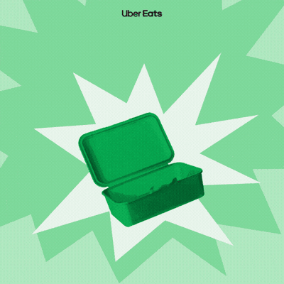 An Uber Eats Advertisement With A Green Lunch Box Bananas And Books GIF