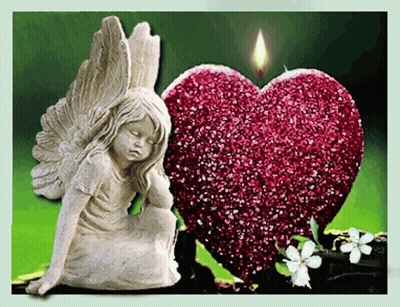 Angel Statue Next To Red Heart With Candle GIF