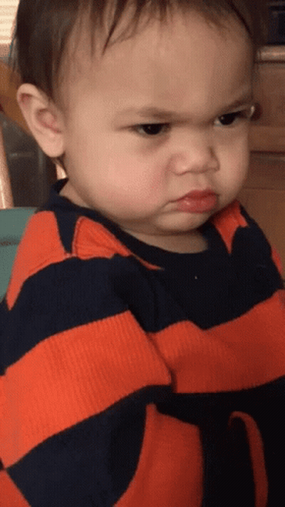 Angry Baby In Orange And Black Striped Shirt GIF
