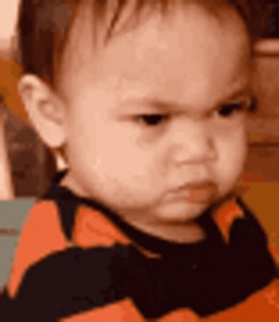 Angry Baby in Striped Shirt