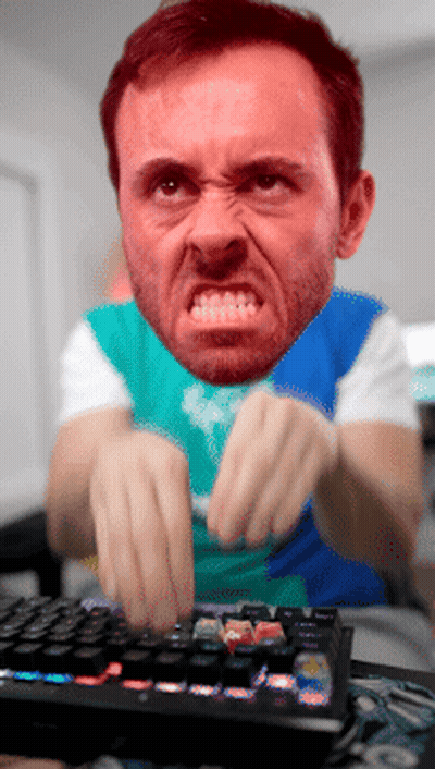 Angry Bearded Man Typing GIF