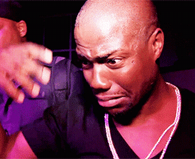 Angry Man In Black Shirt And Necklace GIF