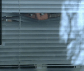 Angry Man Looking Out The Window GIF