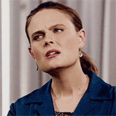 Angry Woman In Blue Jacket And Earrings GIF