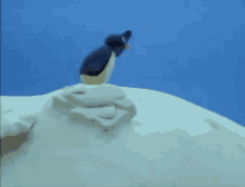 Animated Penguin Searching On Top Of Hill GIF