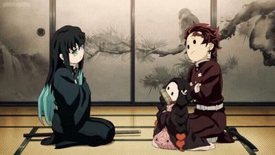 Anime Characters Sitting, One Holding Small Doll GIF