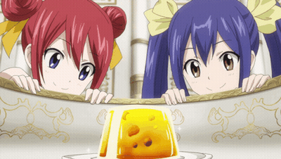 Anime Girls Peeking Over Table Near Yellow Jelly GIF