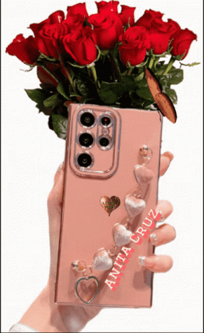 Anita Cruz Holding Phone With Red Roses GIF