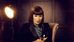 Anjelica Huston Tossing Drink  GIF