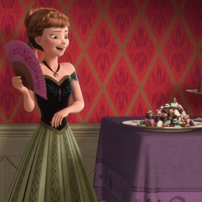 Anna From Frozen Holding Fan In Front Of Chocolates GIF